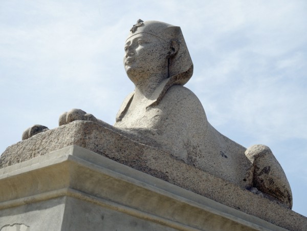 One of a pair of sphinxes in pink Aswan granite set up at the foot of the column known as "Pompey's Pillar", after they were found nearby in 1906
