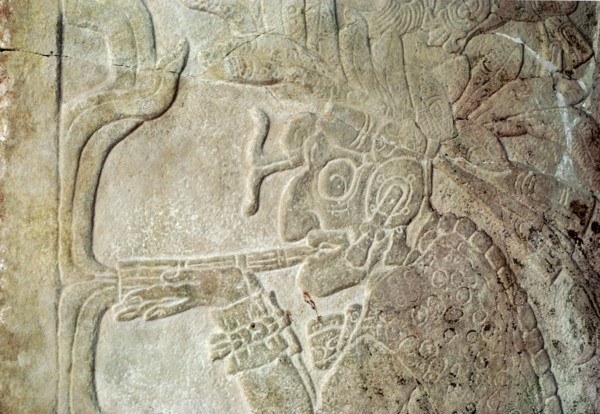 Detail of a bas relief sculpture showing the smoking God L, associated with commerce and the underworld