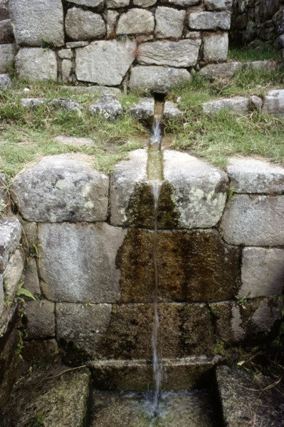 Still functioning water conduit leading into an Inca "bath" at Machu Picchu