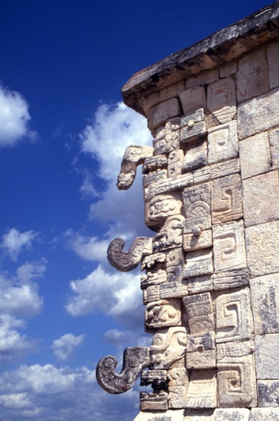 Cornice of building from Uxmal, showing the distinctive snarling mouth and curled nose of the Maya god of rain, Chac