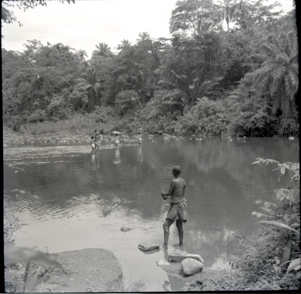 Boys crossing river