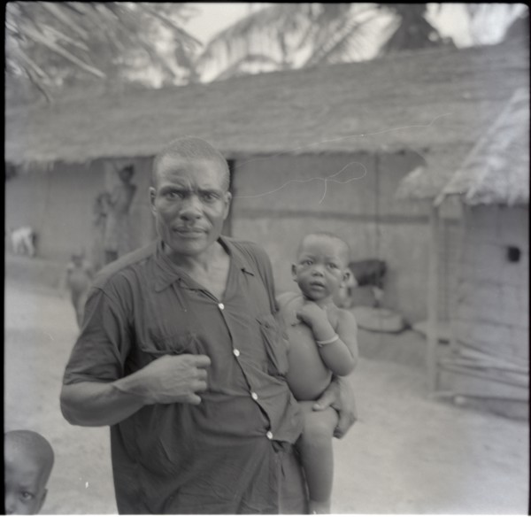 Tanyi Tiku and children in compound