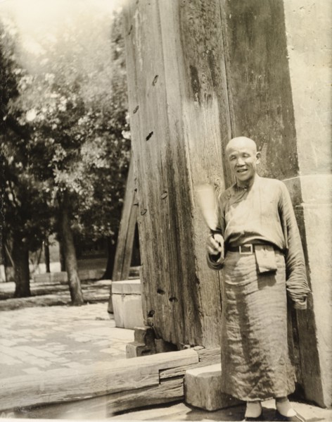 Lama priest at the doorway to a temple