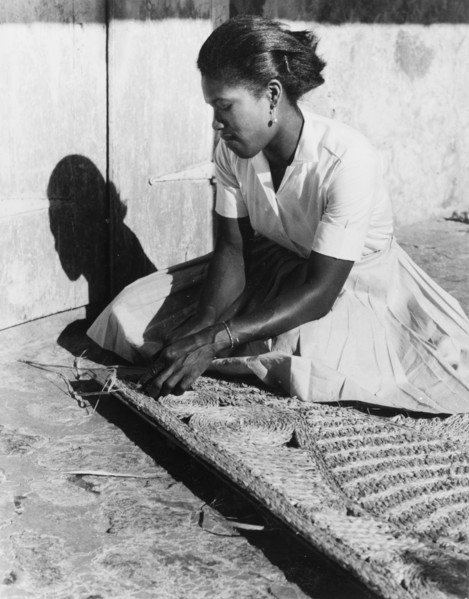 Weaving a palm mat, Dominica