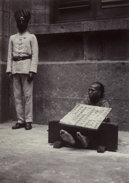 Petty criminal in the stocks, Hong Kong