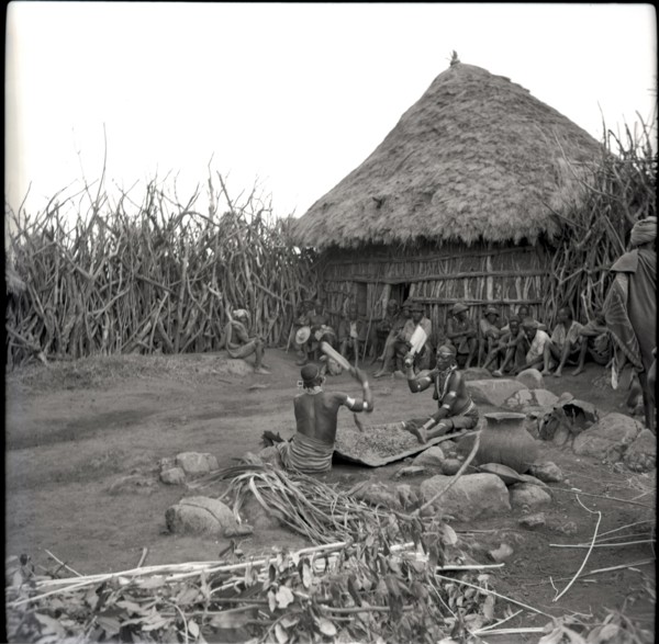 Women beating finger-millet