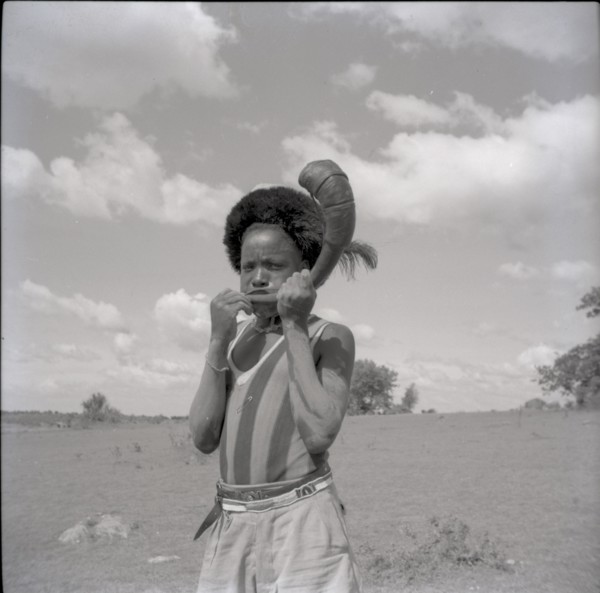 Youth with horn