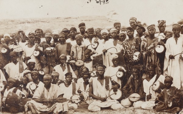 Group of dancers and tom-tom drummers posing for the camera