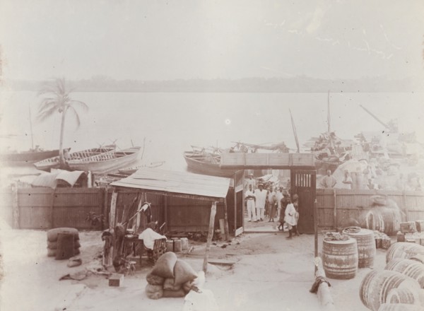 View from bungalow at Badagry showing barrels of oil and bags of nuts