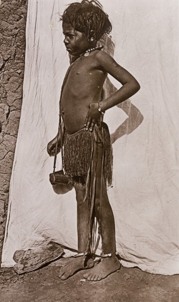 Portrait of a young girl dressed in a grass skirt