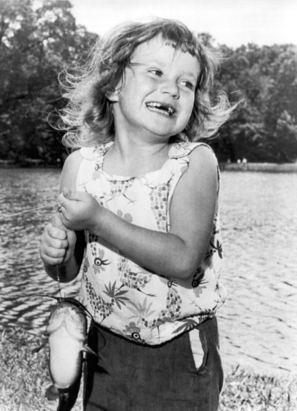 Happy Girl With Catfish