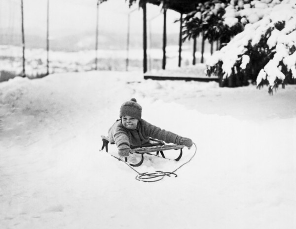 A Small Girl On A Sled