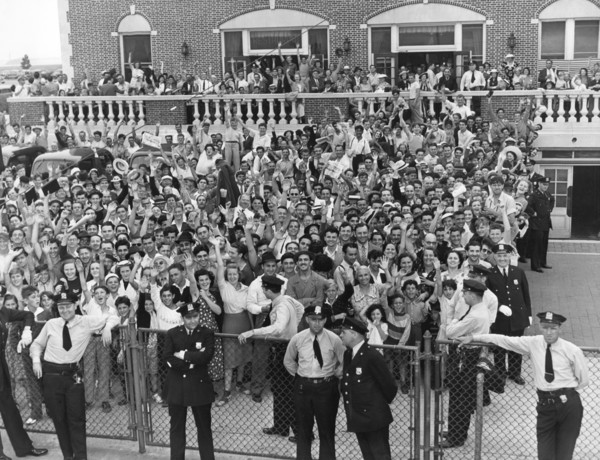 Crowd Welcomes Howard Hughes