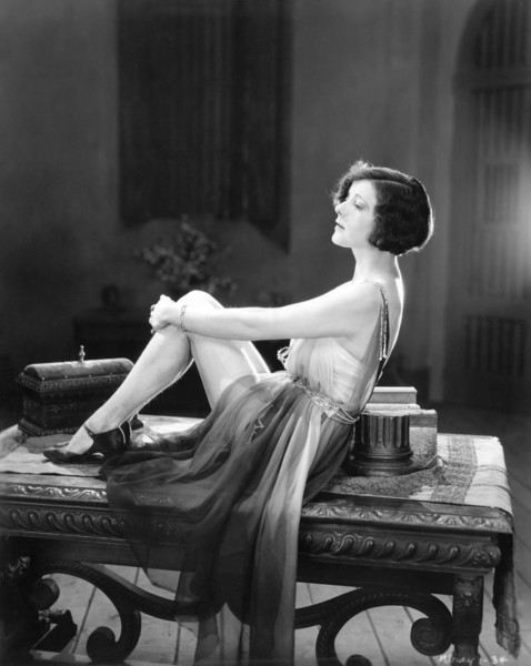 A Woman Sitting On A Table