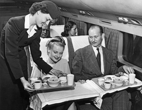 A Stewardess Serving Breakfast