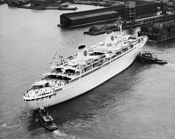 Tugs Pushing Ocean Liner