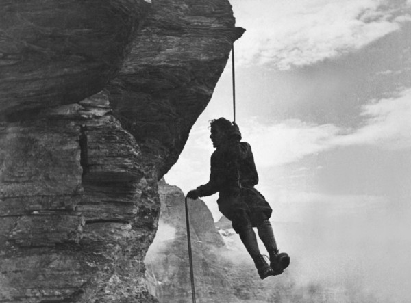 A Mountain Climber Rappelling
