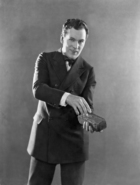 Man Holding A Brick