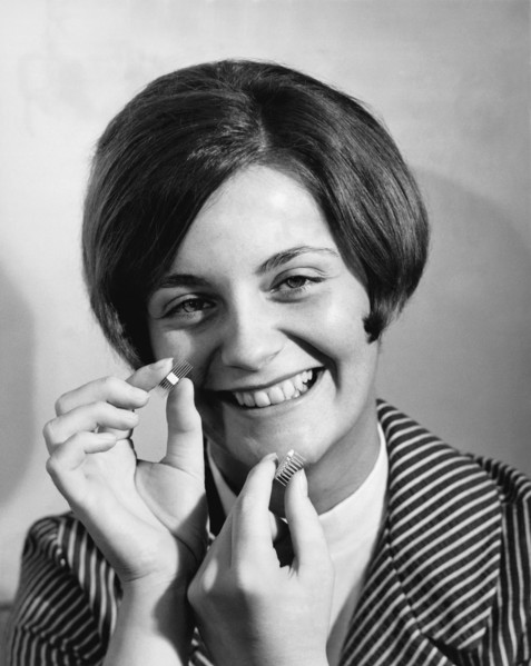 Woman Holds Integrated Circuit