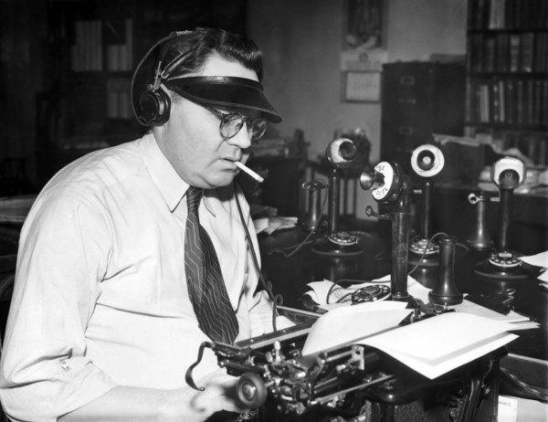 Newspaper Man At His Desk