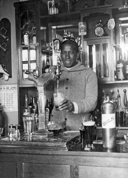 Amsterdam, Netherlands: 1928.
Uruguayan soccer star Andrade pouring a draft beer into a mug for