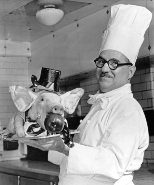 London, England:  February 28, 1961.
A roast pig, complete with top hat, tie, and tails, to be