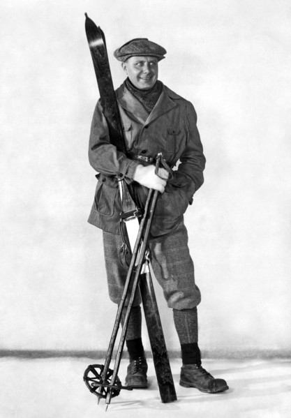 A Man Poses With Skis