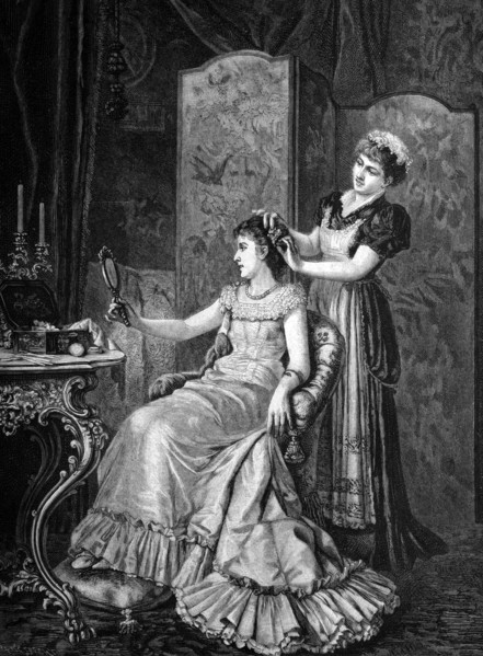 Maid combing a lady