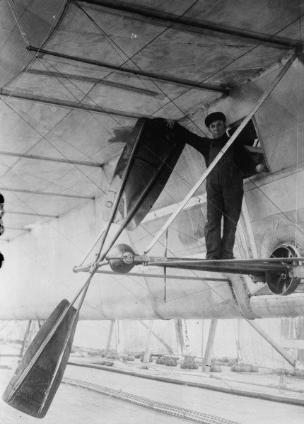 Man posing next to propeller of Wellman air ship, Spitzbergen