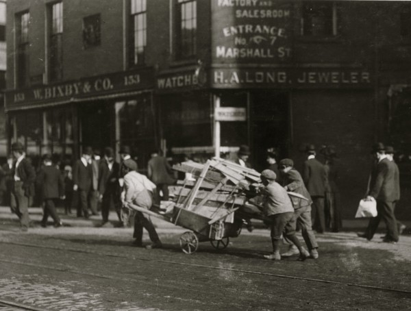 3 Boy Woodpickers Under Way lugging a cart full of firewood. 1909