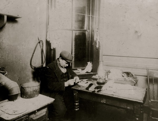 Fifty-five year old man adding a little to income by making feathers.  1912