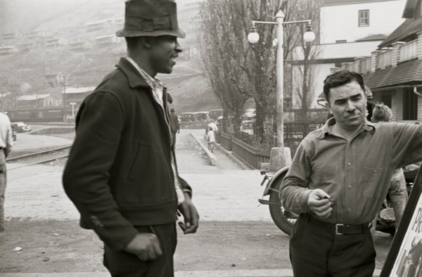 African American and a while man look at a sign 1935
