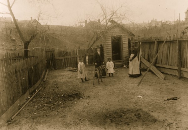 African American family standing in a yard in Georgia 1899