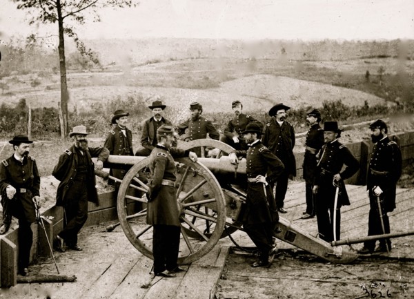 Atlanta, Ga. Gen. William T. Sherman, leaning on breach of gun, and staff at Federal Fort No. 7 1864