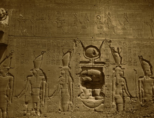 Bas-relief and hieroglyphics cover wall in the Temple of Hathor, located in Dendara, Egypt. 1880