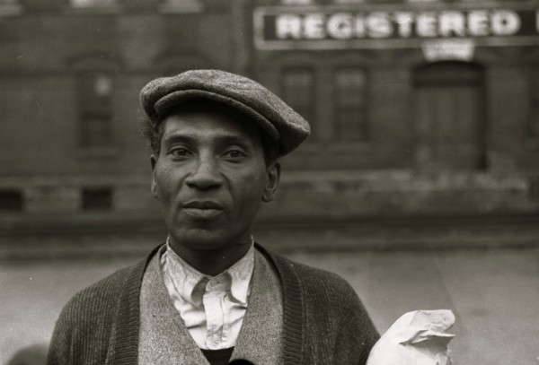 Black waiting for freight train to leave Dubuque, Iowa 1940