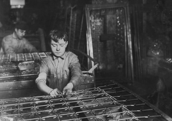 Boys "linking" bed-springs. 14 and 15 years old. 1917