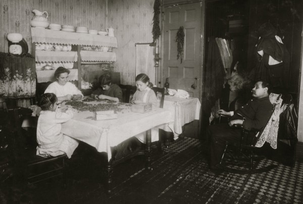 Italian Family picks nuts in their tenement apartment 1911