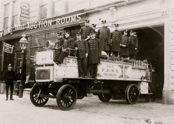 Firemen posed on fire engine, New York City 1914