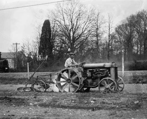 Ford Tractor plowing field 1925