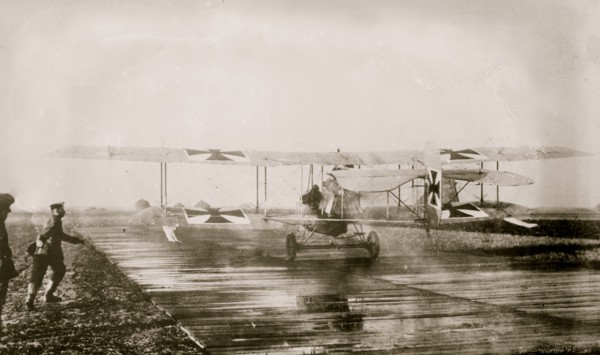 German Military Aviators in their planes on the tarmac