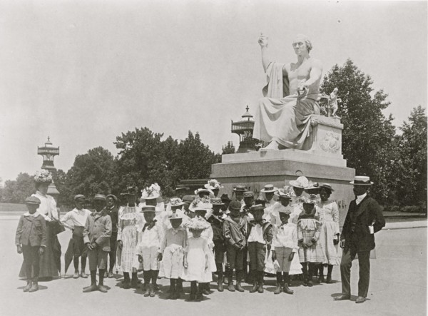 Group of school children in front of statue of George Washington, Washington, D.C. 1899