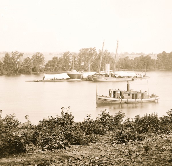 James River, Va. U.S.S. monitor CANONICUS taking on coal from a schooner 1863