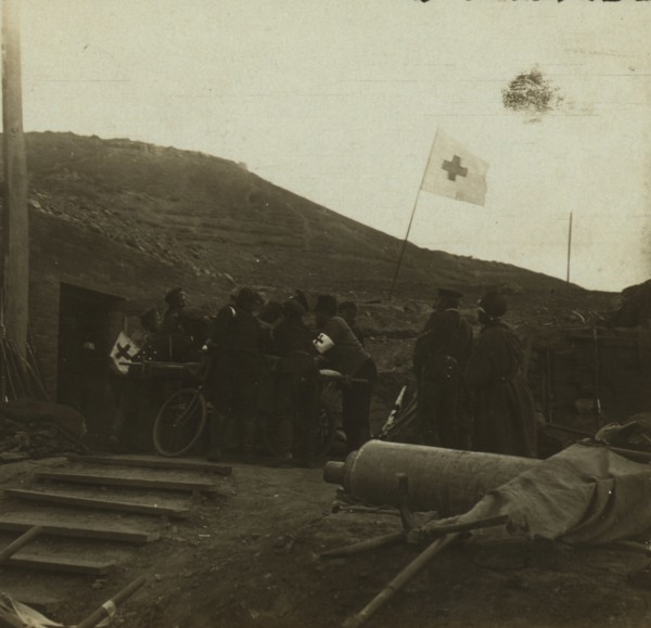 Lifting a wounded Russian to a bicycle stretcher 1905