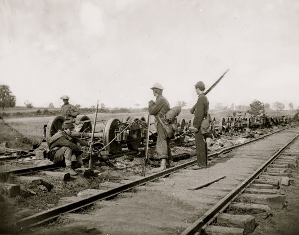 Manassas Junction, Va. Soldiers beside damaged rolling stock of the Orange & Alexandria Railroad 1862