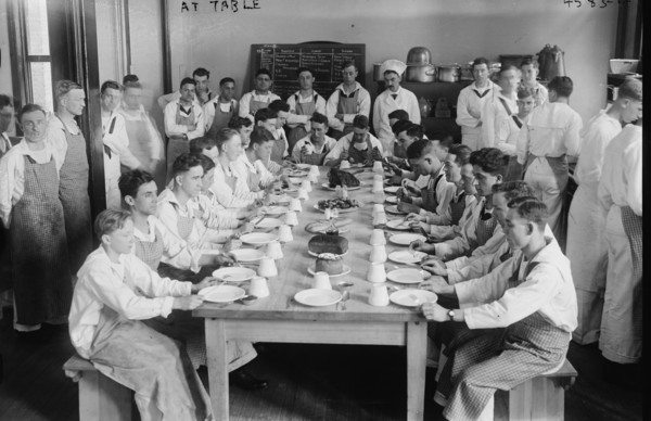 Midshipmen at Dining Table eat in Formation