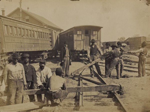 Military railroad operations in northern Virginia: men using levers for loosening rails 1863