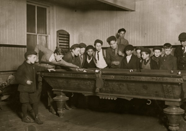 One way to control the street boys. A common scene in the Bancroft-Foote Boys Club, Playing Pool  1909