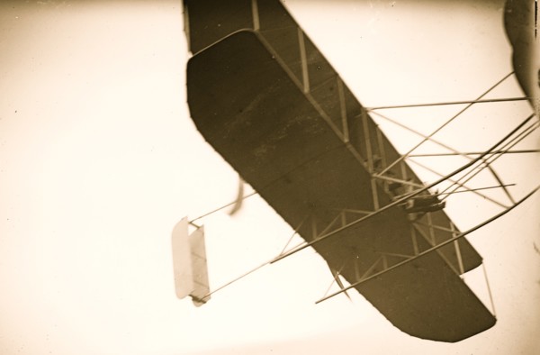 Orville Wright flying in his airplane 1908