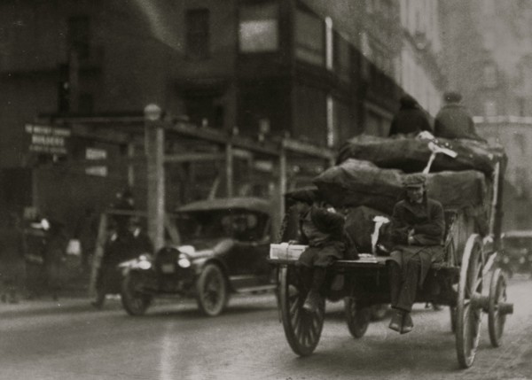 P.M. Delivery boys on Tremont Street, "getting a hitch." 1917